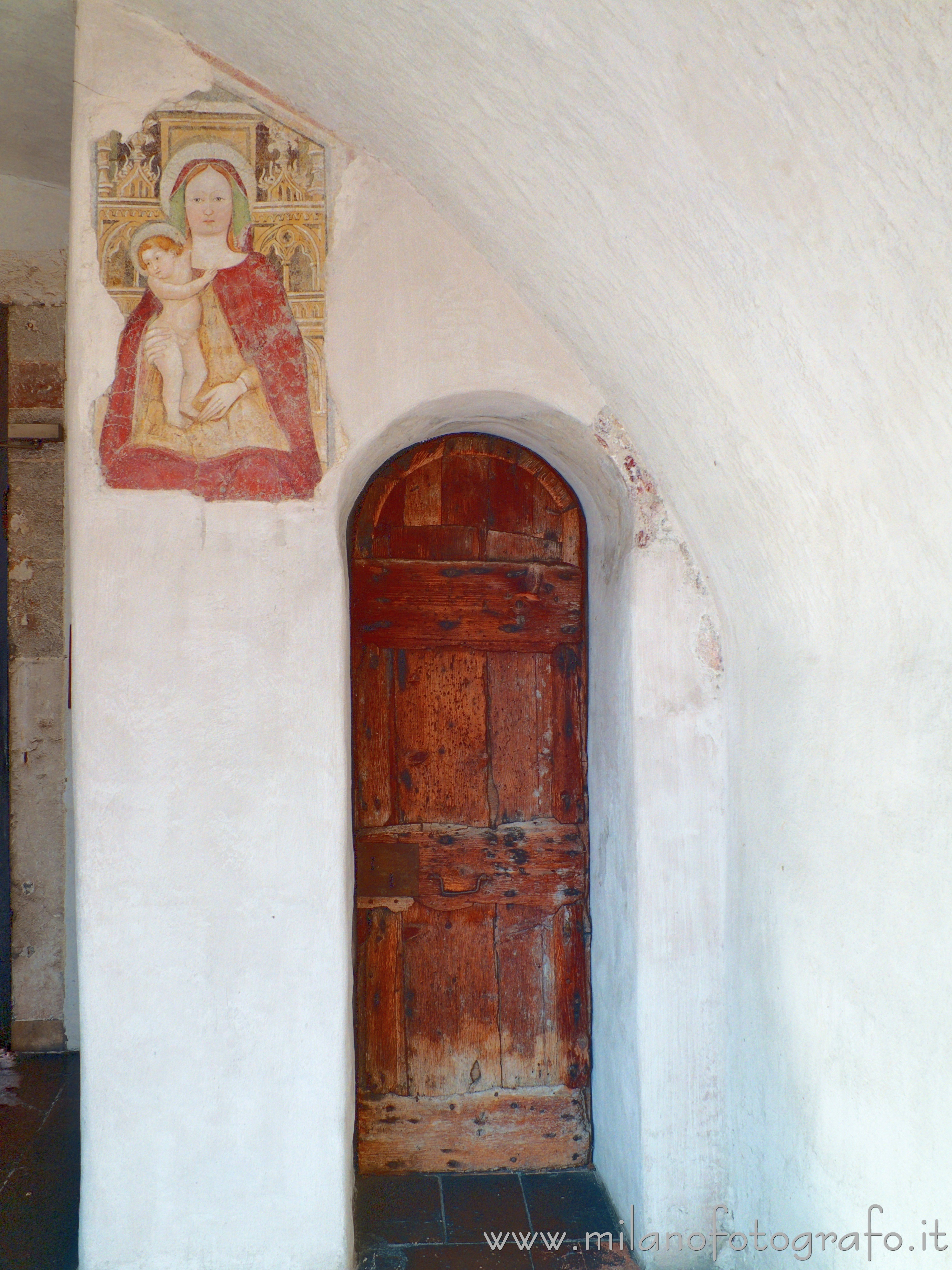 Bergamo (Italy) - Entrance of the bell tower of the Church of San Michele al Pozzo